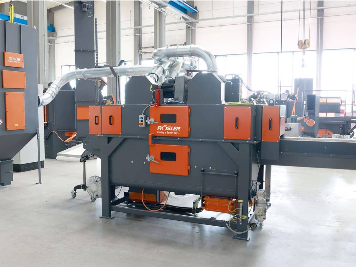 Schaltbau automates de-flashing process with Rösler’s wire mesh belt blast machine